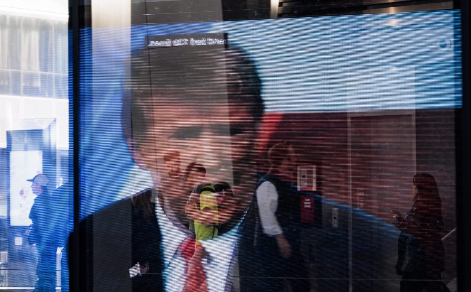 epaselect epa10635306 An image of former President Donald Trump reflected in a window in New York, New York, USA, 17 May 2023. Trump announced his 2024 candidacy to be US president and is considered to be the Republican party’s front-runner.  EPA/JUSTIN LANE