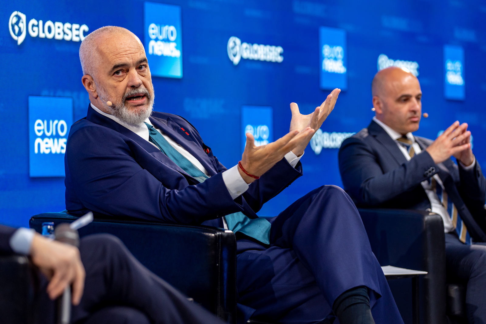 epa10664465 Prime Minister of the Republic of Albania Edi Rama (L) and North Macedonia's Prime Minister Dimitar Kovacevski (R) attend a session titled 'Open Roads: Balkans Back in Business' at GLOBSEC Security Forum in Bratislava, Slovakia, 31 May 2023.  EPA/MARTIN DIVISEK