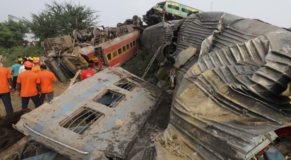epa10669871 Damaged train coaches are piled up as the National Disaster Response Force Rescue continues work at the site of a train accident at Odisha Balasore, India, 03 June 2023. Over 200 people died and more than 900 were injured after three trains collided one after another. According to railway officials the Coromandel Express, which operates between Kolkata and Chennai, crashed into the Howrah Superfast Express.  EPA/PIYAL ADHIKARY