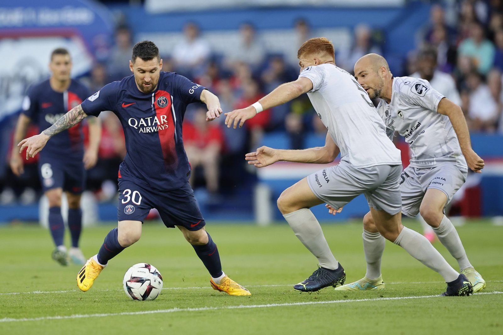 epa10671391 Paris Saint Germain's Lionel Messi (L) in action against Maximiliano Caufriez of Clermont (C) and Johan Gastien of Clermont during the French Ligue 1 soccer match between Paris Saint Germain and Clermont Foot 63 in Paris, France, 03 June 2023.  EPA/CHRISTOPHE PETIT TESSON