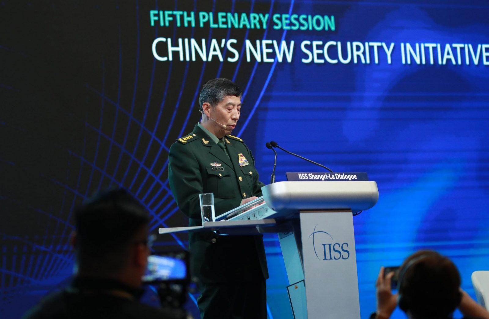 epa10671809 Chinese State Councilor and Minister of National Defence General Li Shangfu delivers his speech during a plenary session of the International Institute for Strategic Studies (IISS) Shangri-la Dialogue at the Shangri-la hotel in Singapore, 04 June 2023. Defense ministers and officials from 41 countries are gathered in the city state for the IISS Shangri-la Dialogue, an annual high level defence summit in the Asia Pacific region.  EPA/HOW HWEE YOUNG
