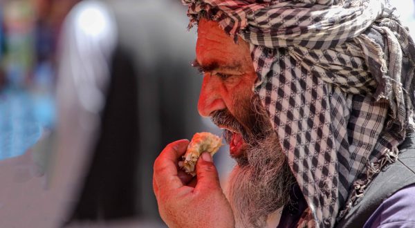 epa10675694 An Afghan man eats food on a roadside on the eve of the World Food Safety Day in Kabul, Afghanistan, 06 June 2023. According to report â€˜The Hunger Hotspotsâ€™ released on 29 May by the United Nations, 22 countries will experience an increase in acute food insecurity over the next six months. Afghanistan, Nigeria, Somalia, South Sudan, and Yemen are at the highest alert level, while Haiti, the Sahel, and Sudan are at the highest concern levels. Low to middle income countries will be driven further into crisis due to unusually high global food prices. Pakistan, the Central African Republic, Ethiopia, Kenya, the Democratic Republic of Congo, Syria, and Myanmar are also hotspots of very high concern. The UN has called for urgent humanitarian action to save lives and livelihoods and prevent starvation and death in hotspots where acute hunger is at a high risk of worsening from June to November 2023.  EPA/SAMIULLAH POPAL