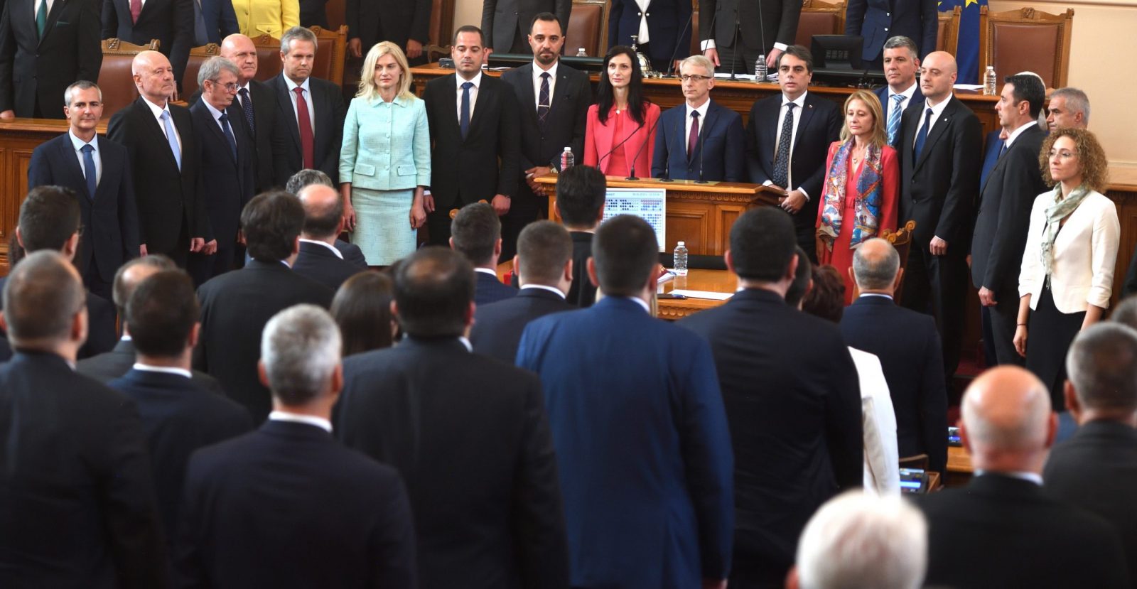 epa10675928 The new Prime Minister Nikolay Denkov (C) takes the oath at the Parliament in Sofia, Bulgaria, 06 June 2023. The two largest parties in Bulgaria, the conservative GERB and the reformist coalition 'Proceeding with the change - Democratic Bulgaria' (PP-BD), have agreed to govern together with a prime minister who will change every nine months, on a rotational formula, which should end two years of political deadlock in the European Union's (EU) poorest country. After the nine months, he will be replaced in the post by the candidate of GERB, the former European Commissioner Maria Gabriel.  EPA/VASSIL DONEV