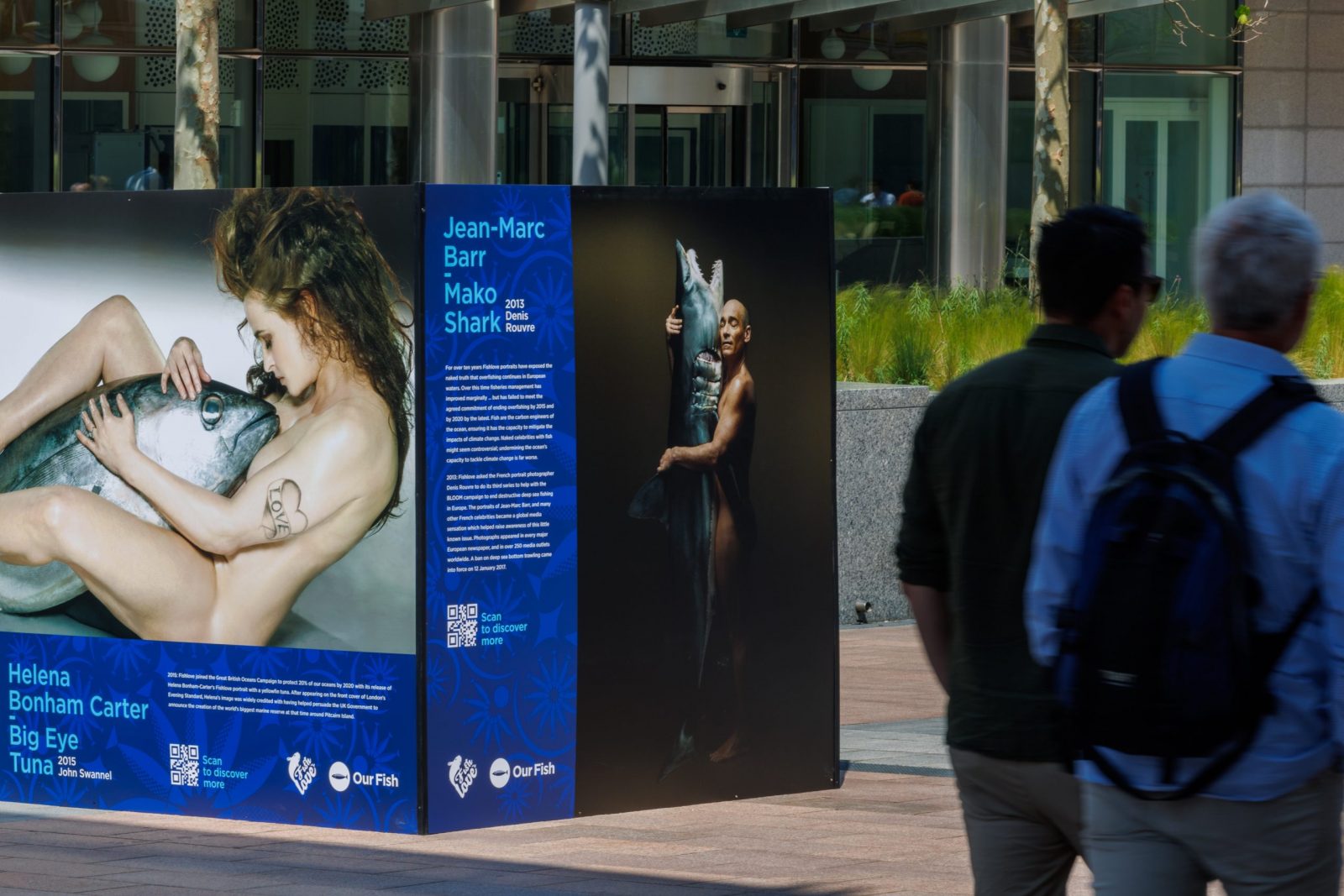 epa10676105 Portraits of celebrities are on display as part of the thought-provoking photo exhibition 'Ending EU Overfishing: The Decade Past and the Decade to Come,' in front of the EU Parliament in Brussels, Belgium, 06 June 2023. Since 2009 celebrities pose naked with fish for Fishlove organisation to promote sustainable fishing and protect marine ecosystems.  EPA/OLIVIER MATTHYS