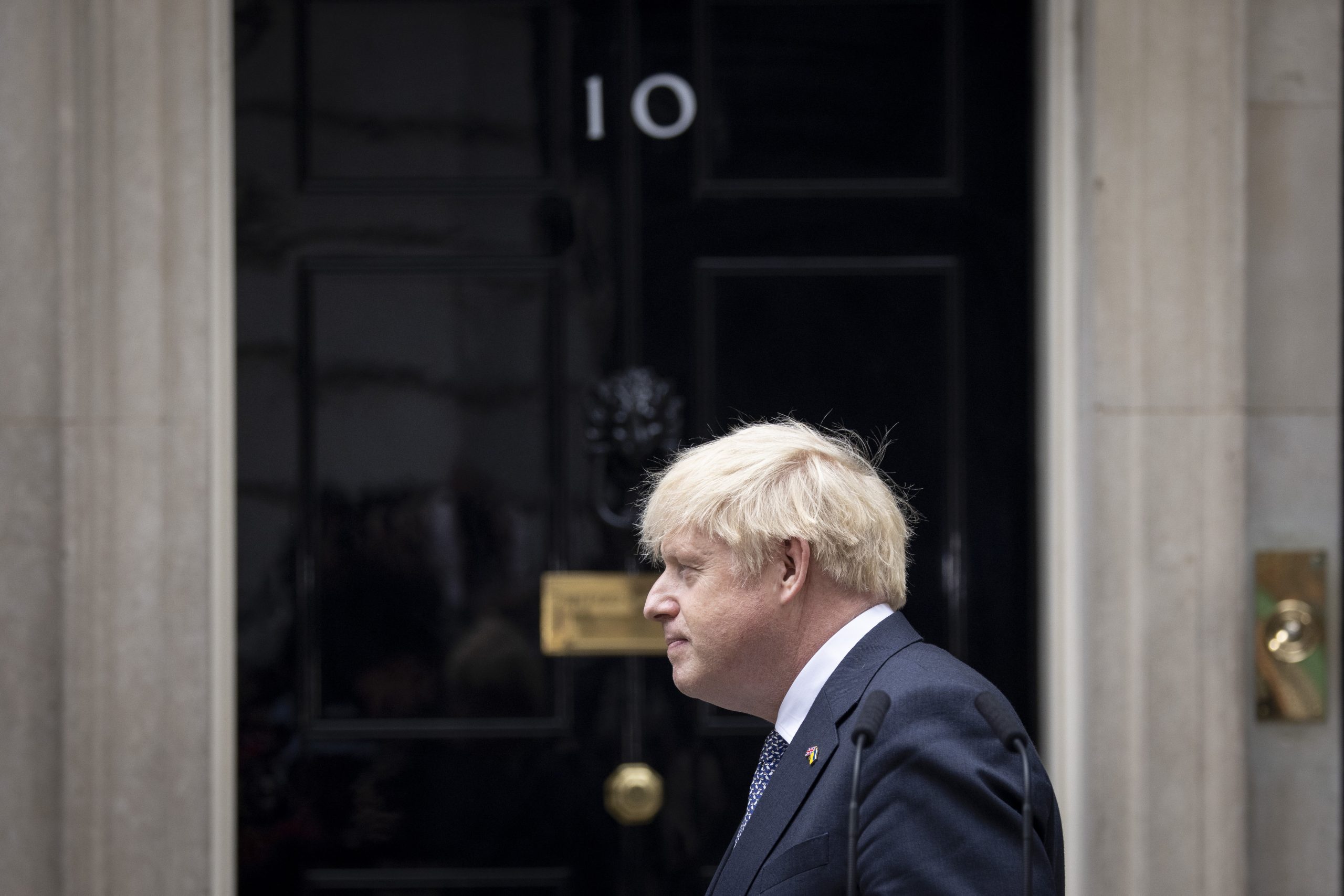 epa10682418 Former British Prime Minister Boris Johnson leaves after announcing his resignation as leader of the Conservative Party in Downing Street, London, Britain, 07 July 2022 (reissued on 09 June 2023). Boris Johnson announced on 09 June that he will be standing down from parliament with immediate effect, after the Privileges Committee investigation into the Partygate scandal recommended a suspension for his conduct..  EPA/TOLGA AKMEN