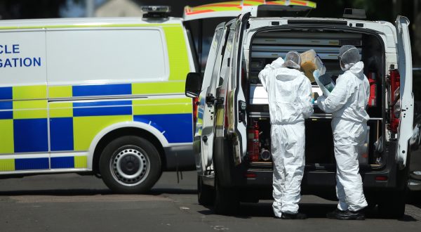 epa10688633 Police forensic officers inspect the scene where a van was found on Bentinck Road in Nottingham, Britain, 13 June 2023. Three people were found dead following what police describe as an 'horrific and tragic incident'. A 31-year-old man was arrested on suspicion of murder. Another three people are in hospital after someone tried to run them over in a van. Police believe the incidents are connected.  EPA/LINDSEY PARNABY