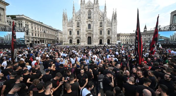 epa10690375 People gather outside the Milan Cathedral (Duomo) ahead of the state funeral for Italy's former prime minister and media mogul Silvio Berlusconi, in Milan, northern Italy, 14 June 2023. Silvio Berlusconi died at the age of 86 on 12 June 2023 at Milan's San Raffaele hospital. The Italian media tycoon and Forza Italia (FI) party founder, dubbed as 'Il Cavaliere' (The Knight), served as prime minister of Italy in four governments. The Italian government has declared 14 June 2023 a national day of mourning.  EPA/CIRO FUSCO
