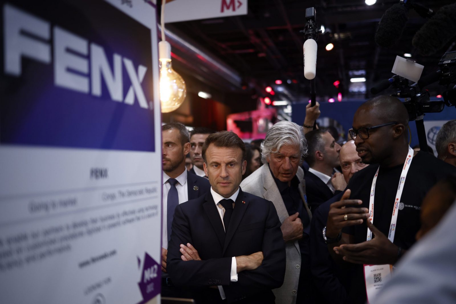 epa10690709 French President Emmanuel Macron (R) visits the Vivatech conference at Porte de Versailles exhibition center in Paris, France, 14 June 2023.  EPA/YOAN VALAT / POOL