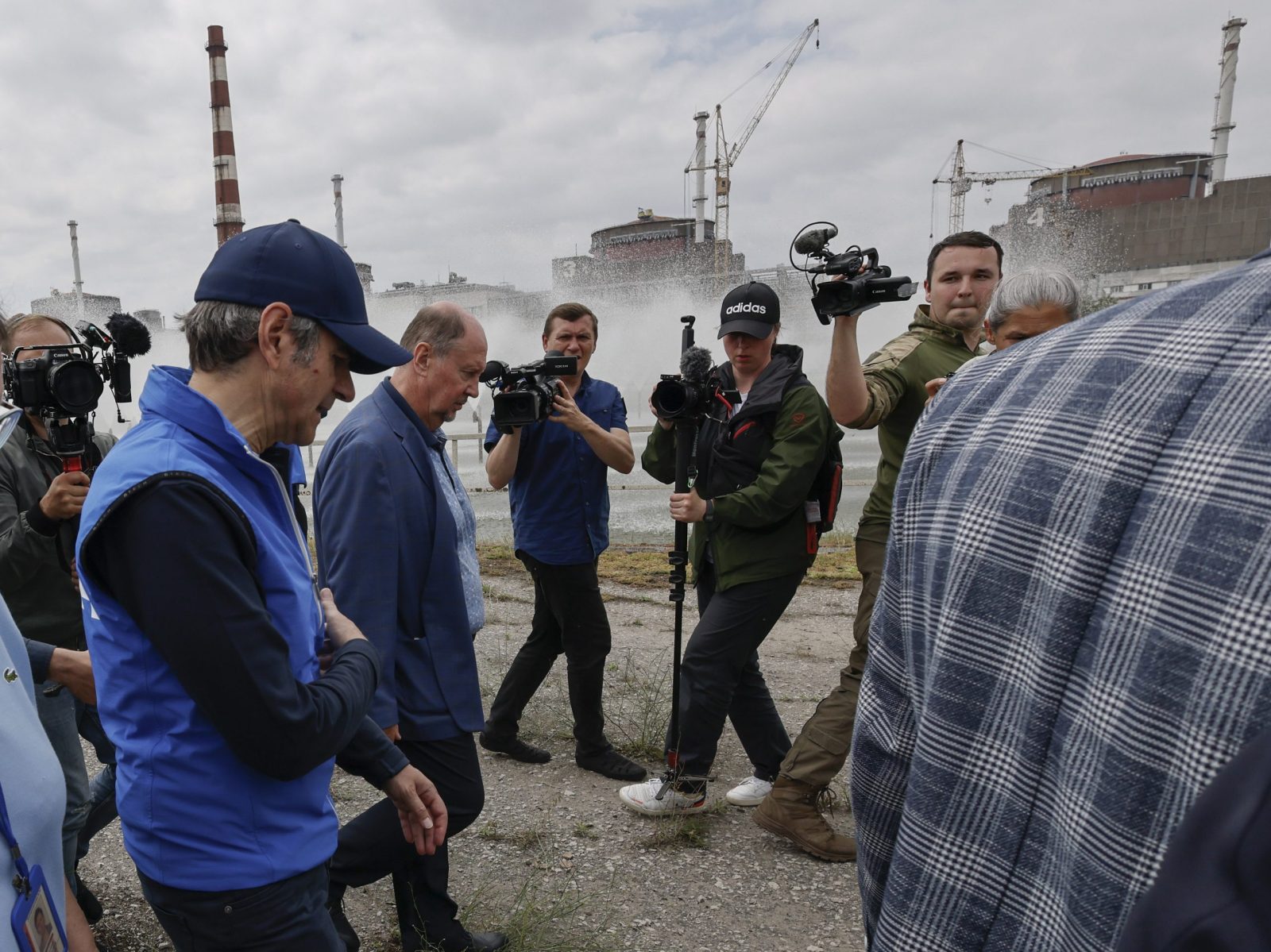 epa10692582 A picture taken during a visit to Enerhodar organised by the Russian Defence ministry shows International Atomic Energy Agency (IAEA) Director-General Rafael Mariano Grossi (L) examines the Zaporizhzhia Nuclear Power Plant in Enerhodar, southeastern Ukraine, 15 June 2023. The Zaporizhzhia Nuclear Power Plant can still continue to draw water from the Kakhovka reservoir, the IAEA reports. Grossi said that after the destruction of the Kakhovka hydroelectric power station, a situation may arise when the water from the Kakhovka reservoir will not be enough to cool the reactors of the Zaporozhye nuclear power plant. According to him, in this case, the reactors can be damaged, which threatens with the onset of radiological consequences. The water level in the reservoir near the Zaporizhzhya TPP has dropped to 11.27 meters and continues to decline.  EPA/SERGEI ILNITSKY