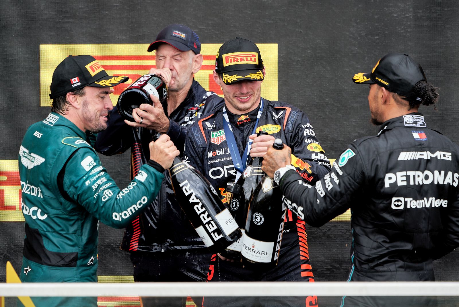 epa10698964 First placed Dutch Formula One driver Max Verstappen (2-R) of Red Bull Racing second placed Spanish Formula One driver Fernando Alonso (L) of Aston Martin, Technical chief Pierre Wache (2-L) of Red Bull Racing and third placed British Formula One driver Lewis Hamilton (R) of Mercedes-AMG Petronas celebrates on the podium after the Formula Oneof the Canada Formula One Grand Prix at the Gilles Villeneuve circuit in Montreal, Canada, 18 June 2023.  EPA/ANDRE PICHETTE