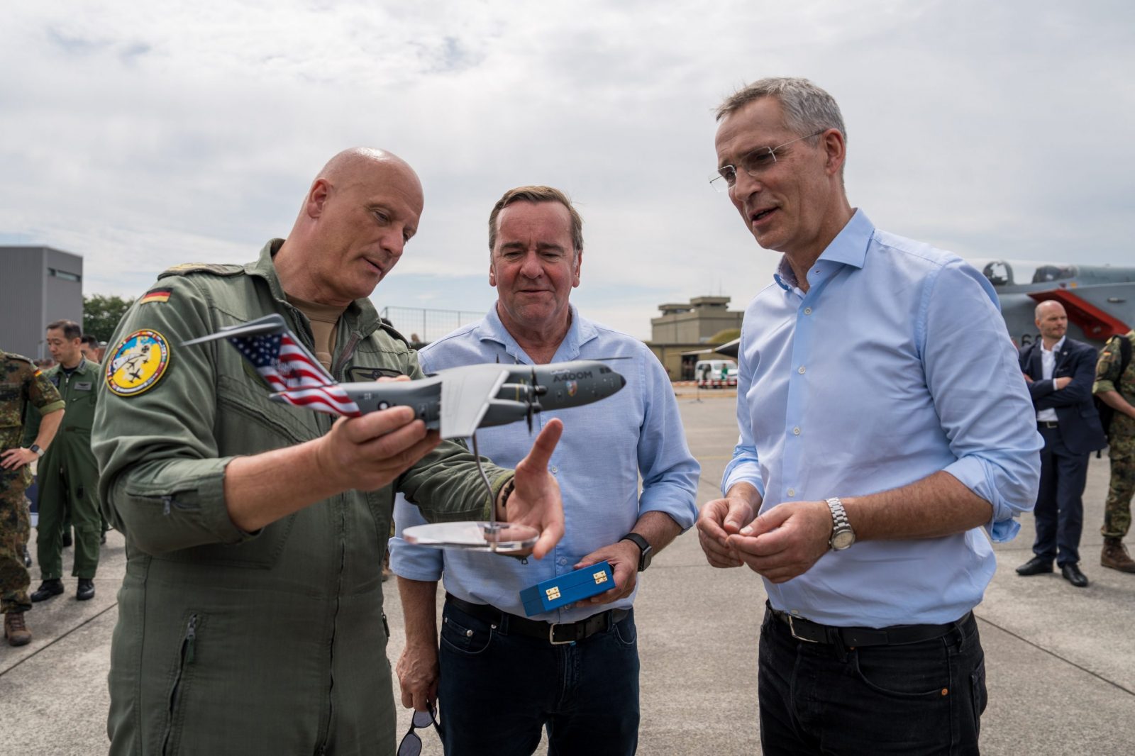 epa10701432 NATO Secretary General Jens Stoltenberg (R) receives a scale model of an Airbus A400M military cargo plane from Chief of Staff of the German Air Force Lieutenant General Ingo Gerhartz (L), standing next to German Defense Minister Boris Pistorius (C), during his visit of the NATO Air Defender 2023 exercise, in Jagel, Germany, 20 June 2023. The 'Air Defender 2023' maneuver is the largest North Atlantic Treaty Organization (NATO) redeployment exercise of air forces in its existence and takes place from 12 to 23 June gathering up to 10,000 participants from 25 nations with 250 aircraft to train air operations in European airspace under the command of the German Air Force, the German Armed Forces (Bundeswehr) explains on their website.  EPA/MARTIN ZIEMER / POOL