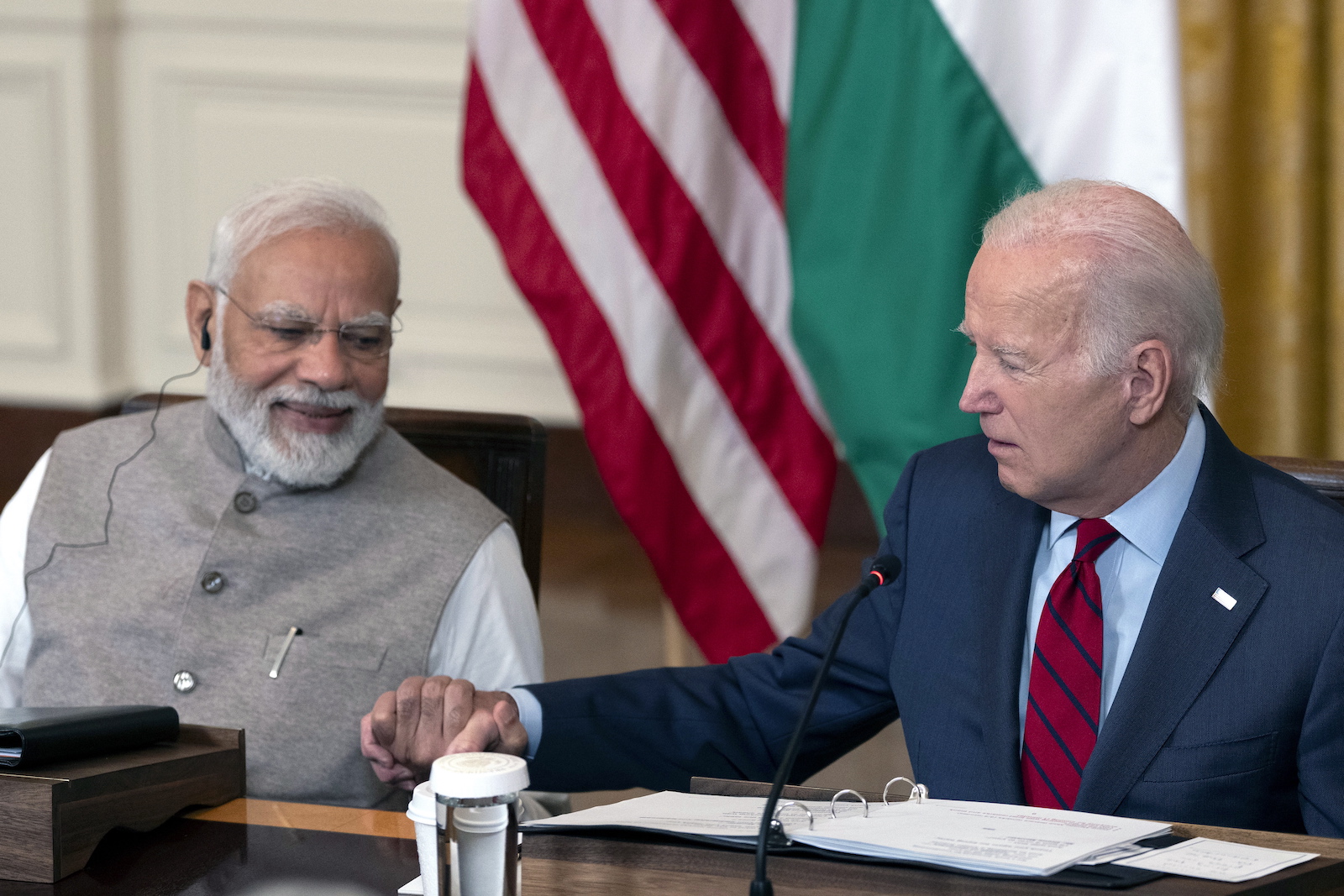 epa10708323 Indian Prime Minister Narendra Modi (L) and US President Joe Biden (R) hold hands during a meeting with senior officials and CEOs of US and Indian companies gathered to discuss innovation, investment and manufacturing in a variety of technology sectors, at the White House in Washington, DC, USA, 23 June 2023.  EPA/CHRIS KLEPONIS / POOL