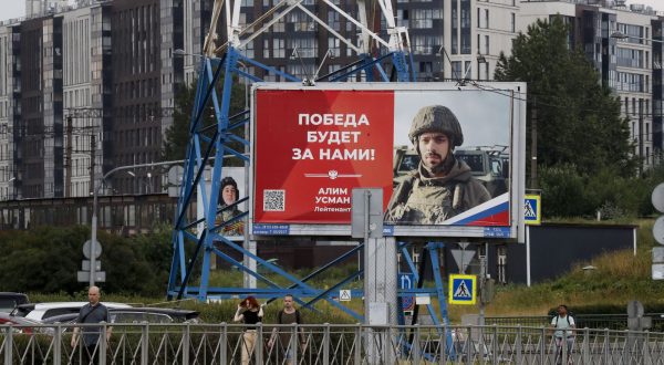 epa10712490 People walk past billboards depicting soldiers and carrying slogans reading 'The victory will be ours!' in St. Petersburg, Russia, 26 June 2023. On 24 June, counter-terrorism measures were enforced in Moscow and other Russian regions after private military company (PMC) Wagner Group chief Yevgeny Prigozhin claimed that his troops had occupied the building of the headquarters of the Southern Military District in Rostov-on-Don, demanding a meeting with Russia's defense chiefs. Belarusian President Lukashenko, a close ally of Putin, negotiated a deal with Wagner chief Prigozhin to stop the movement of the group's fighters across Russia, the press service of the President of Belarus reported. The negotiations were said to have lasted for the entire day. Prigozhin announced that Wagner fighters were turning their columns around and going back in the other direction, returning to their field camps.  EPA/ANATOLY MALTSEV