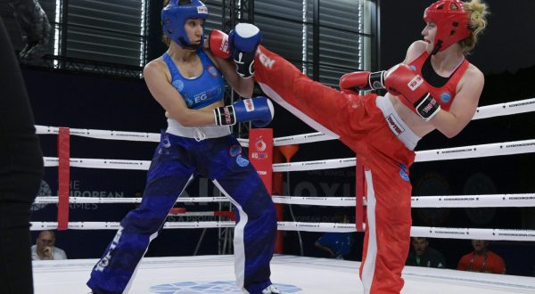 epa10719290 Cintia Czegeny (red) of Hungary in action against Busra Demirayak of Turkey during the quarter final round of the women's kickboxing point fighting 60kg category at the European Games Krakow 2023 in Myslenice, near Krakow, Poland, 30 June 2023.  EPA/Szilard Koszticsak HUNGARY OUT