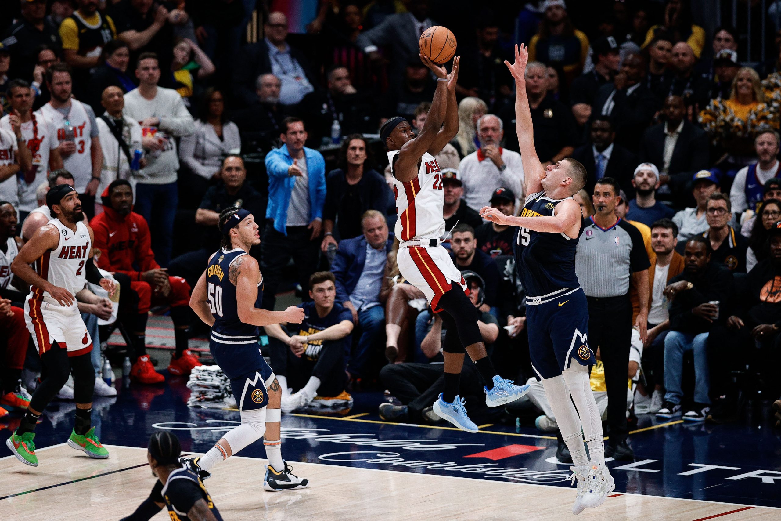 Jun 4, 2023; Denver, CO, USA; Miami Heat forward Jimmy Butler (22) takes a shot against Denver Nuggets center Nikola Jokic (15) in the second quarter in game two of the 2023 NBA Finals at Ball Arena. Mandatory Credit: Isaiah J. Downing-USA TODAY Sports Photo: Isaiah J. Downing/REUTERS