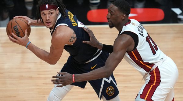 Jun 9, 2023; Miami, Florida, USA; Denver Nuggets forward Aaron Gordon (50) controls the ball while defended by Miami Heat center Bam Adebayo (13) during the second half in game four of the 2023 NBA Finals at Kaseya Center. Mandatory Credit: Jim Rassol-USA TODAY Sports Photo: Jim Rassol/REUTERS