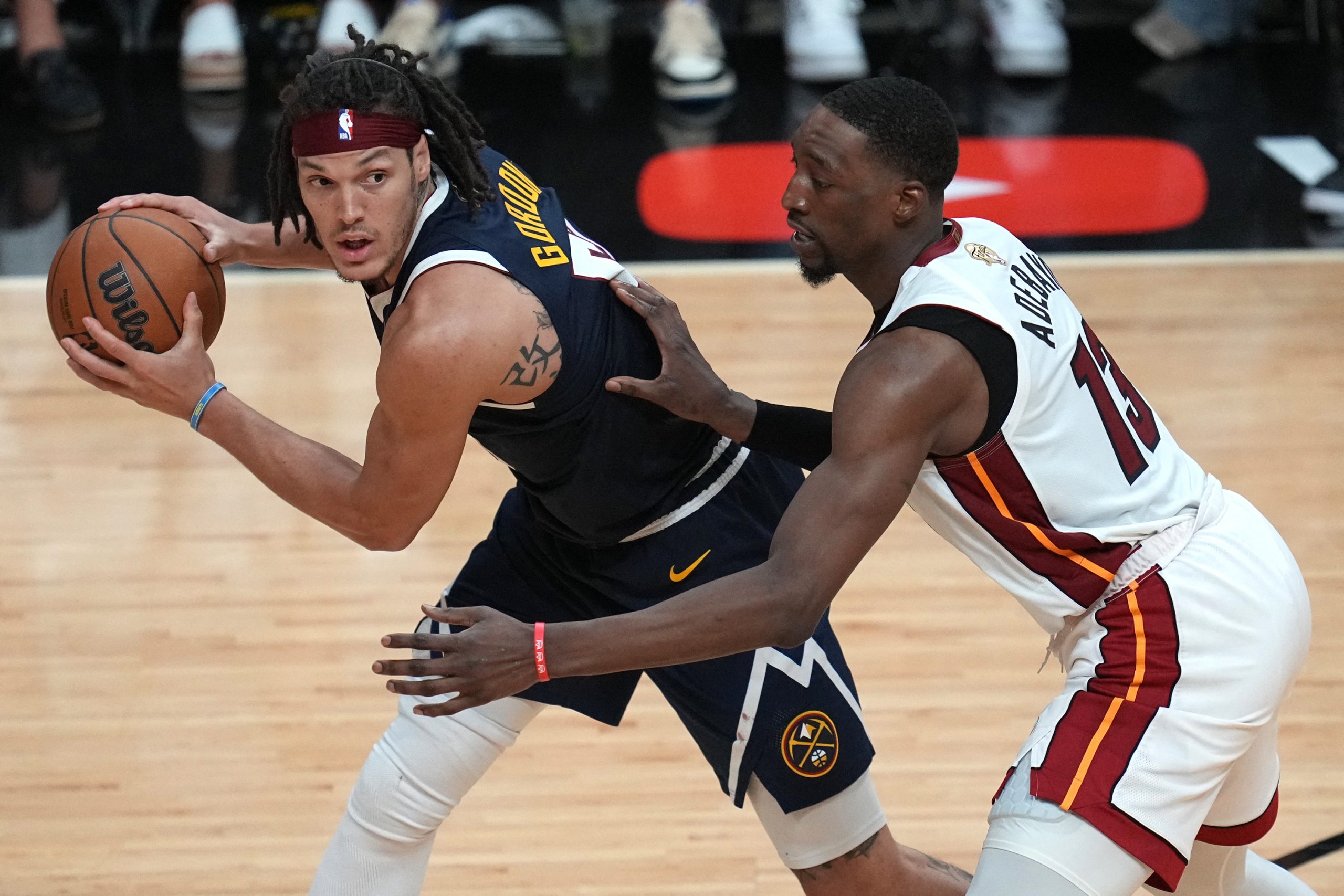 Jun 9, 2023; Miami, Florida, USA; Denver Nuggets forward Aaron Gordon (50) controls the ball while defended by Miami Heat center Bam Adebayo (13) during the second half in game four of the 2023 NBA Finals at Kaseya Center. Mandatory Credit: Jim Rassol-USA TODAY Sports Photo: Jim Rassol/REUTERS