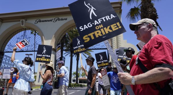 Striking writers and actors picket outside Paramount studios in Los Angeles on Friday, July 14, 2023. This marks the first day actors formally joined the picket lines, more than two months after screenwriters began striking in their bid to get better pay and working conditions. (AP Photo/Chris Pizzello)