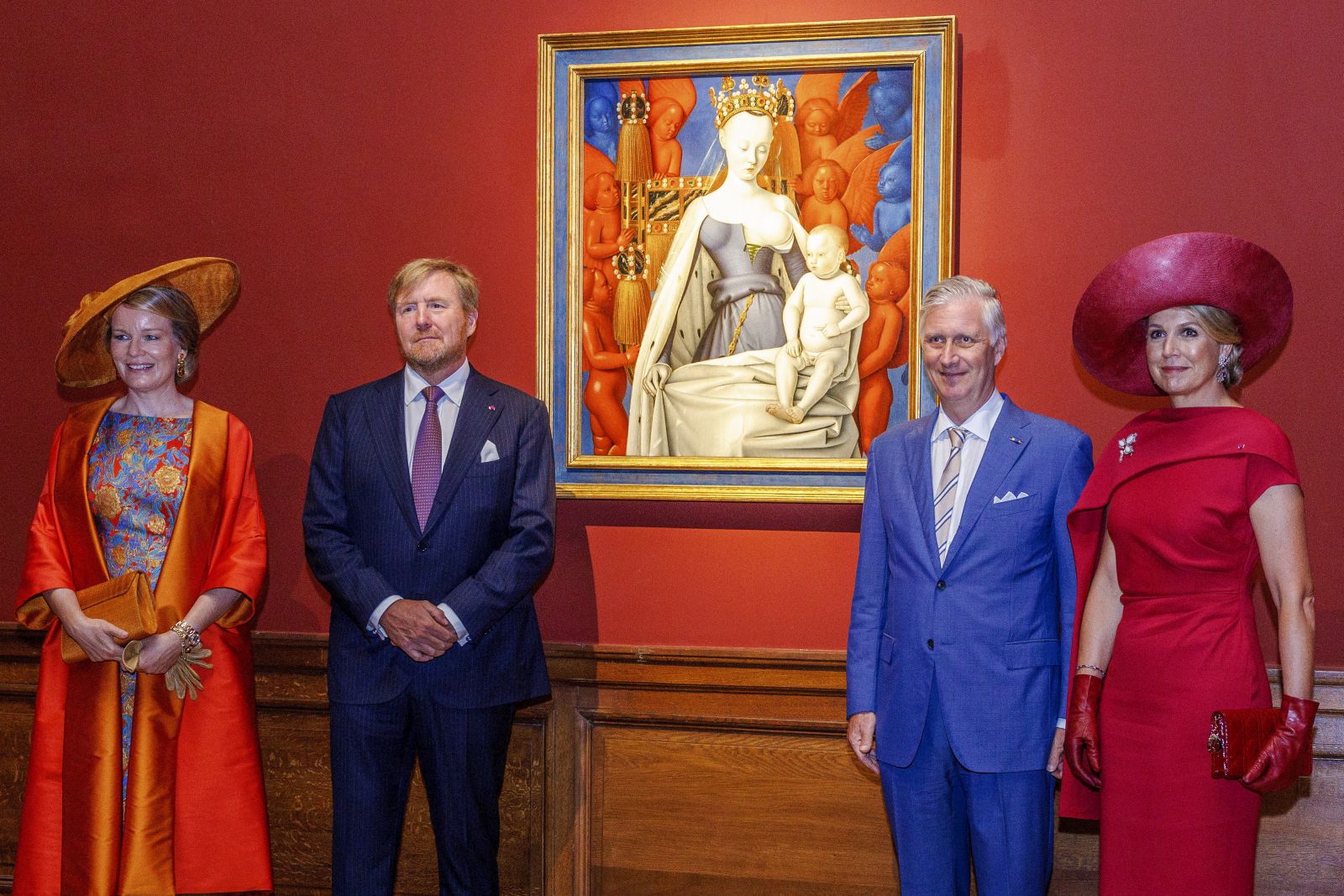 epa10705704 (L-R) Queen Mathilde of Belgium, King Willem-Alexander of the Netherlands, King Philippe of Belgium and Queen Maxima of the Netherlands stand beside the 15th century painting titled ‘Madonna surrounded by Seraphim and Cherubim’ by Jean Fouquet at the Royal Museum of Fine Arts on the third day of the Dutch Royals' state visit to Belgium, in Antwerp, Belgium, 22 June 2023.  EPA/OLIVIER MATTHYS