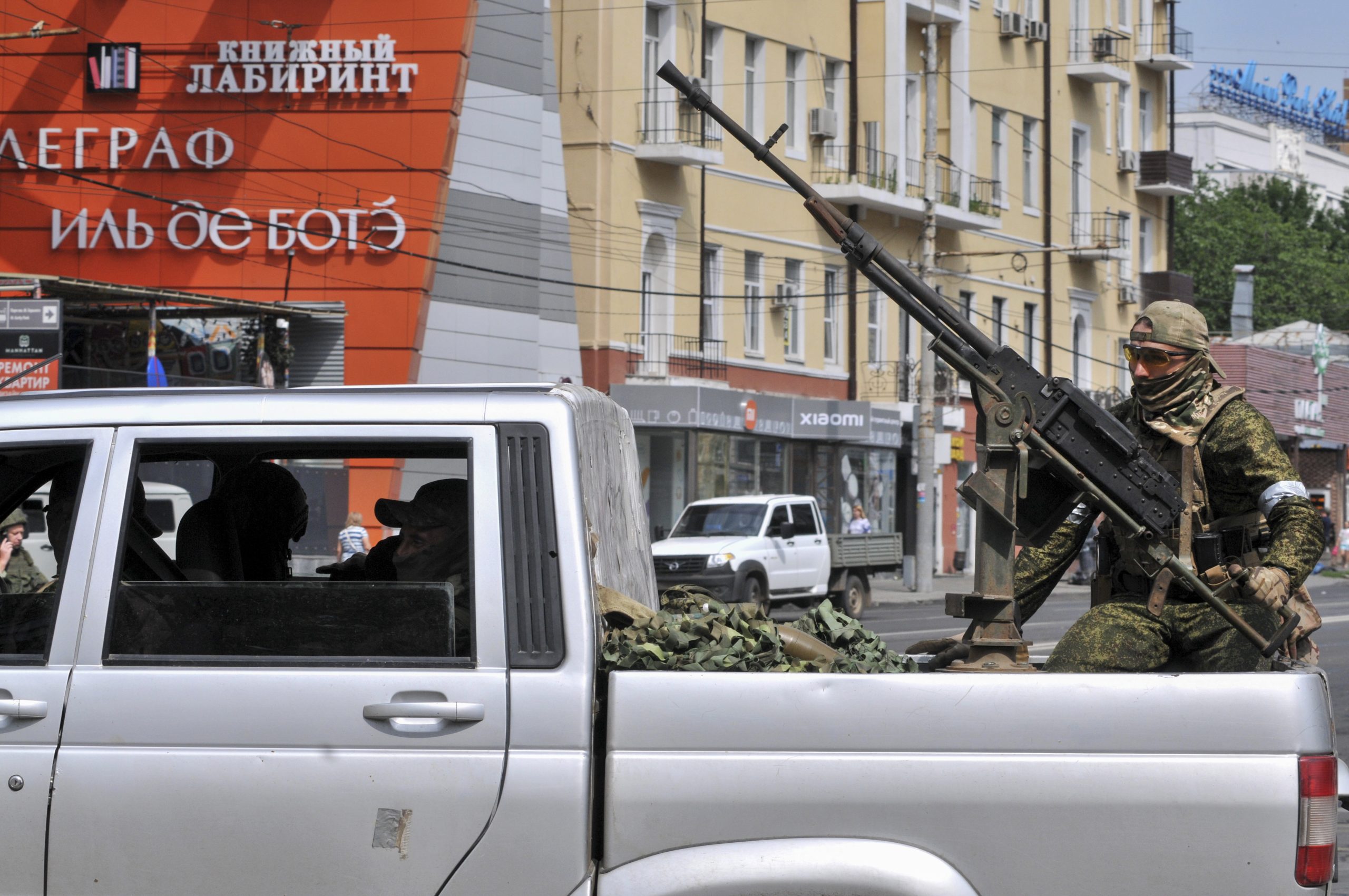 epa10709145 Servicemen from private military company (PMC) Wagner Group block a street in downtown Rostov-on-Don, southern Russia, 24 June 2023. Security and armoured vehicles were deployed after Wagner Group's chief Yevgeny Prigozhin said in a video that his troops had occupied the building of the headquarters of the Southern Military District, demanding a meeting with Russia’s defense chiefs.  EPA/ARKADY BUDNITSKY