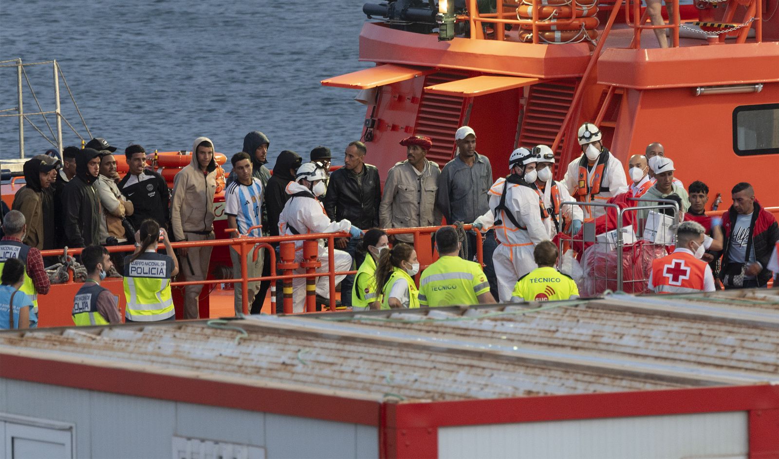 epa10713115 A group of 41 migrants, including a child, reach the port on board a Spanish Sea Rescue Unit's ship in the town of Arrecife, Lanzarote island, southwestern Spain, 26 June 2023 (issued on 27 June 2023). The boat was found 36 km off island's coast.  EPA/Adriel Perdomo