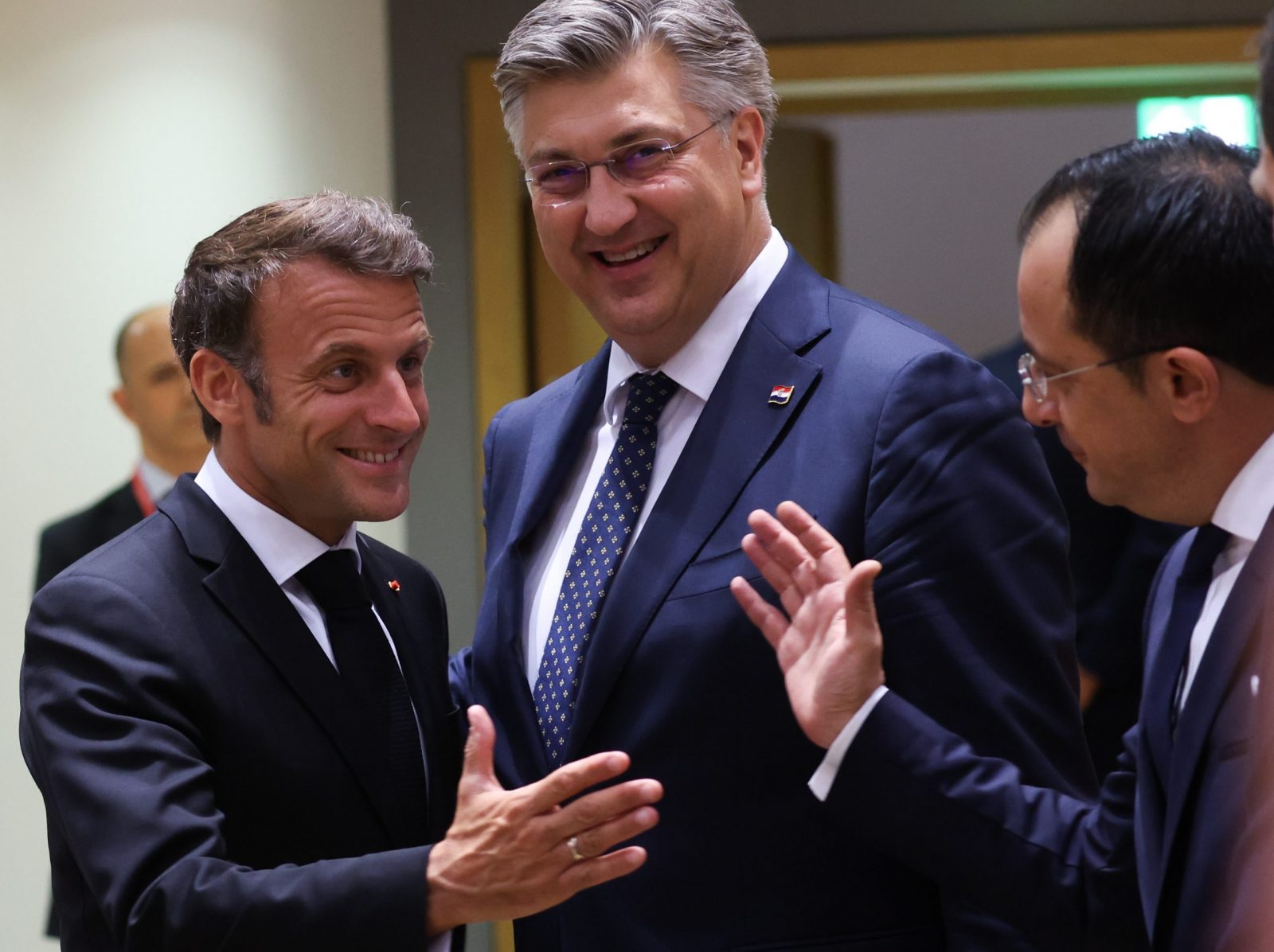 epa10717276 (L-R) French President Emmanuel Macron, Croatian Prime Minister Andrej Plenkovic and President of the Republic of Cyprus Nicos Christodoulides during a European Council in Brussels, Belgium, 29 June 2023. EU leaders are gathering in Brussels for a two-day summit to discuss the latest developments in relation to Russia's invasion of Ukraine and continued EU support for Ukraine as well as the block's economy, security, migration and external relations, among other topics.  EPA/OLIVIER HOSLET