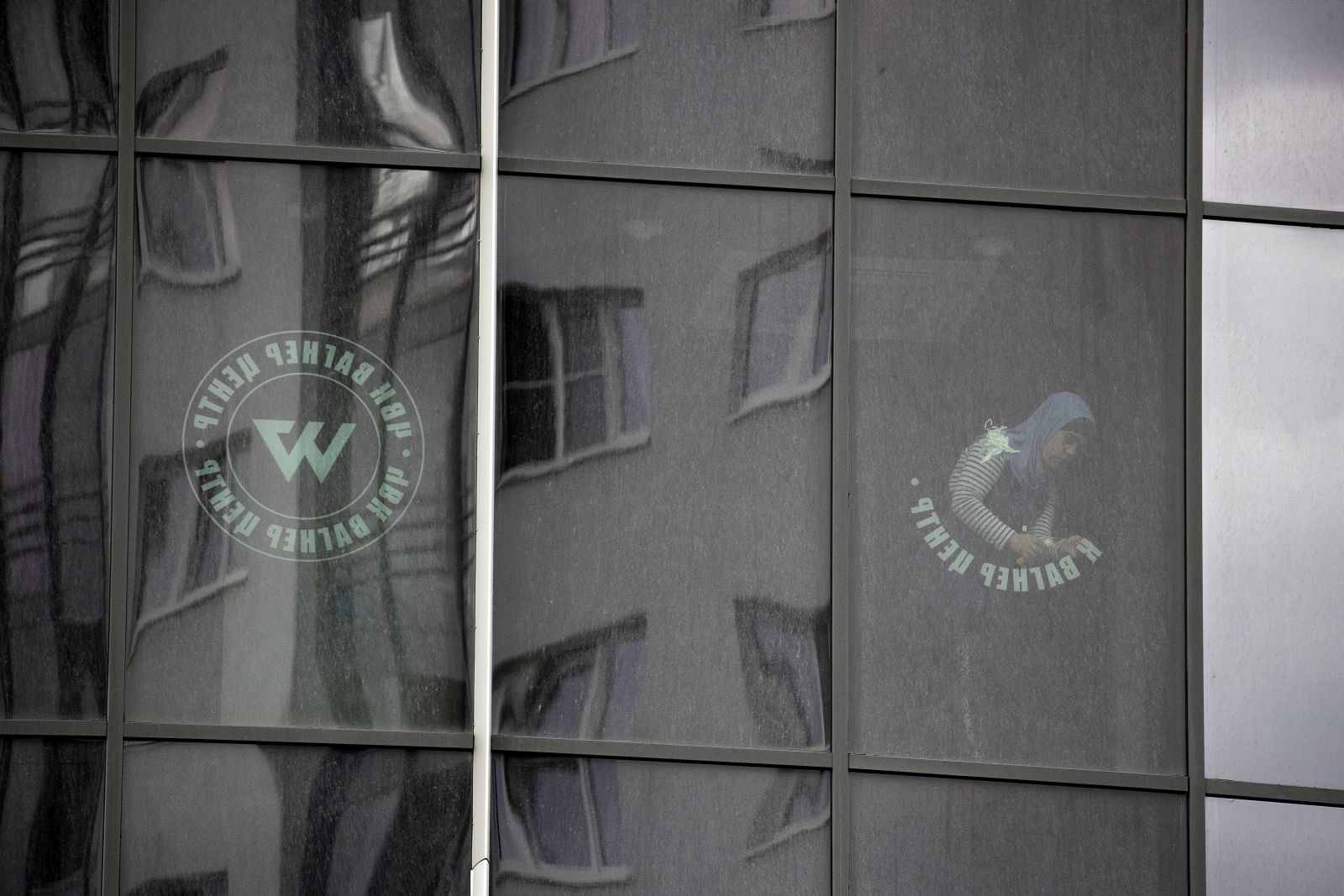 epa10722704 A worker removes the logo of the private military company (PMC) Wagner Group from the windows of the Sea Capital (Morskaya Stolitsa) business center, where Yevgeny Prigozhin's company rented several floors in St. Petersburg, Russia, 02 July 2023. On 23 June 2023, Wagner Group forces led by Prigozhin left the frontline in Ukraine and staged an 'armed mutiny' against Russia's military leadership. Prigozhin claimed on 24 June 2023 that his troops had occupied the headquarters of the Southern Military District in Rostov-on-Don, Russia, a key city near the Ukrainian border. A deal negotiated by the Belarusian president with Prigozhin stopped the Wagner forces' movement toward Moscow and ended the standoff, with Prigozhin and his fighters leaving the country.  EPA/ANATOLY MALTSEV