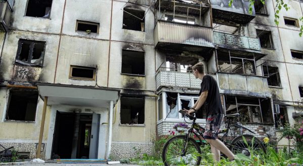 epa10722886 A local man stands near damaged residential building in Shebekino, Belgorod region, Russia, 02 July 2023. According to local authorities, an average of 500 ammunition per day has fallen on the Belgorod region in recent weeks, prompting Governor Vyacheslav Gladkov to evacuate the inhabitants of Shebekino, as well as nearby villages. However, the number of shells decreased in the last three days recording no more than 30. More than 50 percent of large and medium-sized enterprises in the Shebekinsky urban district of the Belgorod region returned to work after attacks by the Armed Forces of Ukraine, Gladkov said on his VKontakte page. He also said that the Shebekino municipal services restored 65 apartment buildings and 62 private households after shelling.  EPA/STRINGER