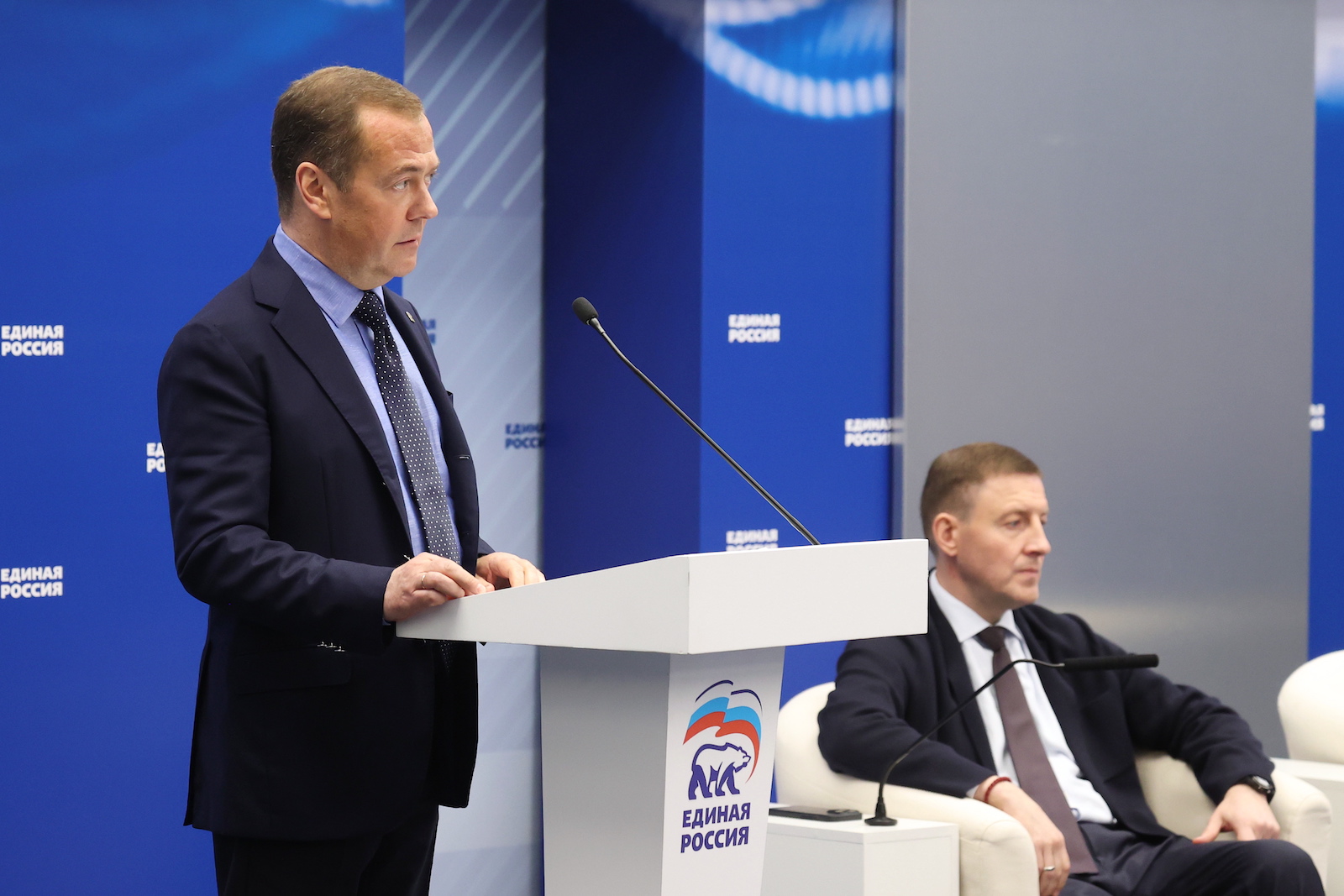 epa10726680 Deputy head of Russia's Security Council and chairman of the United Russia party, Dmitry Medvedev (L) delivers a speech as United Russia Party's General Council Secretary, Russian Federation Council Deputy Chairperson Andrei Turchak seats near during a meeting of the United Russia Party's General Council in Moscow, Russia, 04 July 2023.  EPA/EKATERINA SHTUKINA/ SPUTNIK / GOVERNMENT PRESS SERVICE POOL MANDATORY CREDIT