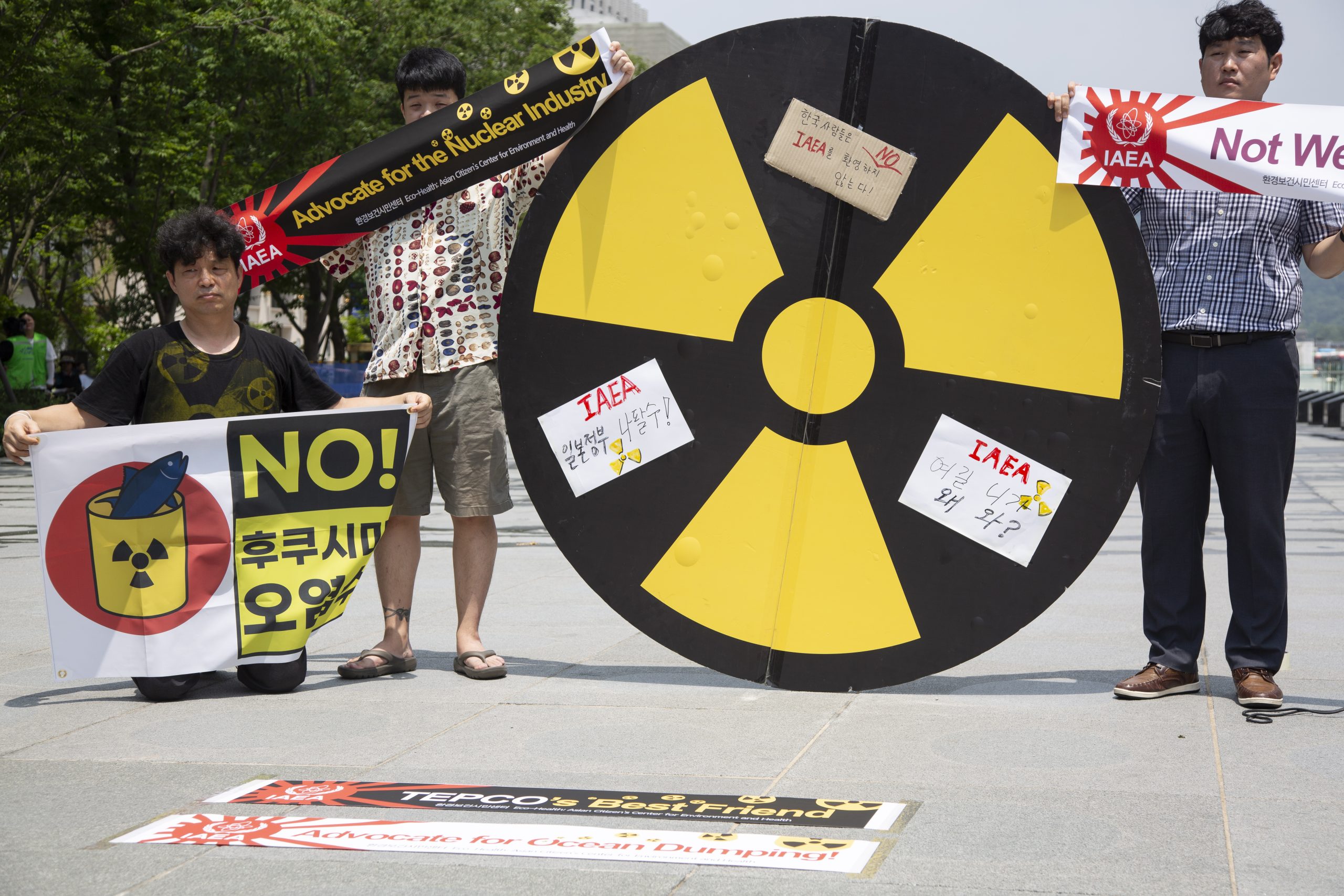 epa10728878 Members of an environmental group hold banners reading 'No Fukushima radioactive water' during a rally against the Internationsl Atomic Energy Agency's (IAEA) report on Japan's disposal of radioactive water; in Seoul, South Korea, 06 July 2023. According to the IAEA, Japan's plans to release treated water stored at the Fukushima Daiichi nuclear power station into the sea are consistent with IAEA Safety Standards and the discharge of the treated water would have a negligible radiological impact on people and the environment.  EPA/JEON HEON-KYUN