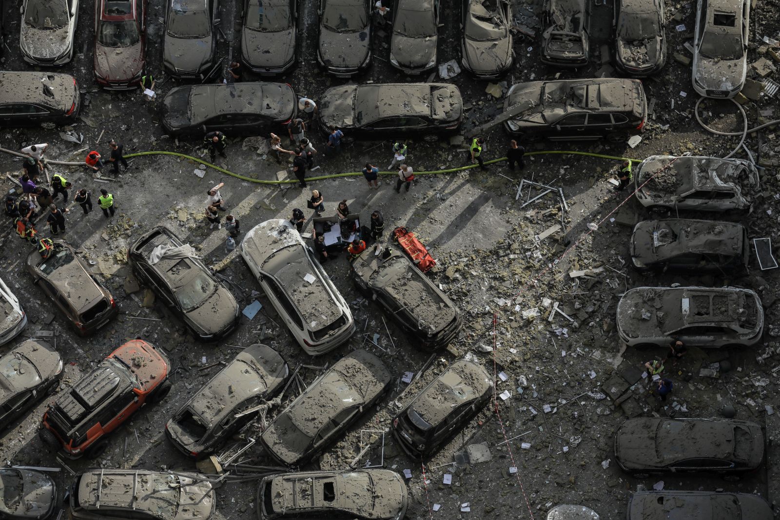 epa10731555 (FILE) - Cars covered in debris in the yard of an apartment block damaged by rocket fragments in Kyiv (Kiev), Ukraine, 24 June 2023, amid the Russian invasion. At least three people were killed by rocket fragments hitting a high-rise building in the capital's Solomyan district, Kyiv Mayor Vitali Klitschko confirmed. According to the Ukrainian Air Force, Russia fired 41 missiles and one shock drone on Ukraine. All air targets were shot down.  EPA/OLEG PETRASYUK