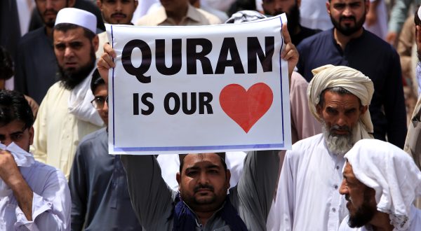 epa10732362 A man holds a placard during a protest against the burning in Sweden of a copy of the Koran, the Muslims' holy book, in Peshawar, Pakistan, 07 July 2023. Pakistan's prime minister called for nationwide protests on 07 July against a recent desecration of the Koran, the holy book of Islam, in Sweden. An Iraqi refugee living in Sweden set fire to a copy of the Koran during a protest in front of a mosque in Stockholm on 28 June 2023. The act drew widespread outrage and condemnation from several countries, including Pakistan, Turkey, Saudi Arabia, Jordan, Palestine, Morocco, Iran, Iraq, and the European Union.  EPA/BILAWAL ARBAB