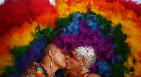 epaselect epa10736836 Two persons kiss during the 24th edition of the Brasilia LGBT+ Pride March, on the esplanade of the Ministries in Brasilia, Brazil, 09 July 2023. With the march towards the National Congress, the capital of Brazil ends its 2023 Pride festival, which began on June 24 and which developed recreational, cultural, and educational activities around diversity and the claim of rights of the LGBT+ community.  EPA/Andre Borges