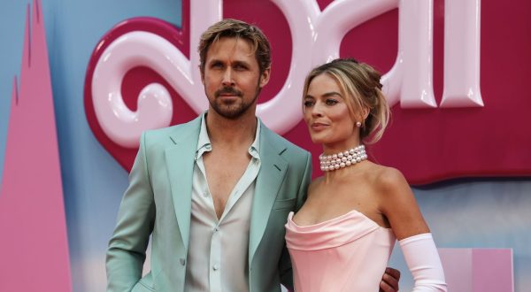 epa10742446 Canadian actor Ryan Gosling (L) and Australian actor Margot Robbie pose on the pink carpet at the European premiere of 'Barbie' in central London, Britain, 12 July 2023. The film will be released in cinemas from 21 July 2023.  EPA/ANDY RAIN