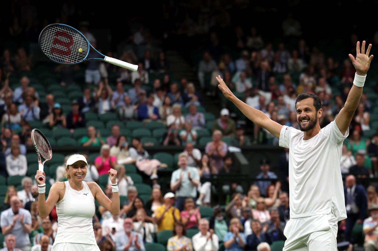epa10744409 Lyudmyla Kichenok of Ukraine (L) and Mate Pavic of Croatia react after winning against Yifan Xu of China and Joran Vliegen of Belgium during their Mixed Doubles final at the Wimbledon Championships, Wimbledon, Britain, 13 July 2023.  EPA/ISABEL INFANTES   EDITORIAL USE ONLY
