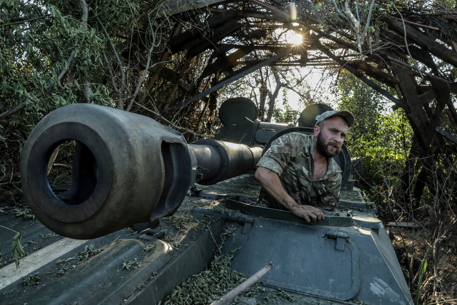 epa10744386 A Ukrainian serviceman of the 24th Separate Mechanized Brigade named after 'King Danylo' maintains a 2S1 Gvozdika self-propelled howitzer at an undisclosed location in the Donetsk region, eastern Ukraine, 13 July 2023, amid the Russian invasion. Russian troops entered Ukraine on 24 February 2022, starting a conflict that has provoked destruction and a humanitarian crisis.  EPA/OLEG PETRASYUK