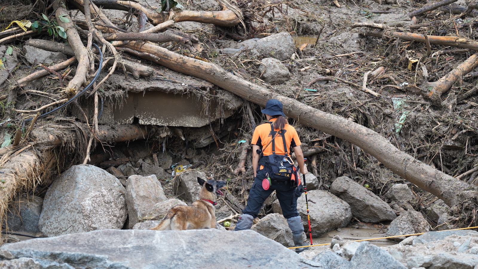 epa10748721 A handout photo made available by the National Fire Agency (NFA) of South Korea shows an emergency worker searching for survivors after heavy rains hit Yecheon county in Gyeongsangbuk-do Province, South Korea, 16 July 2023. According to Yonhap news agency, on 15 July, the heavy rains killed about 20 people and caused thousands to evacuate their homes across the country.  EPA/National Fire Agency of South Korea  HANDOUT EDITORIAL USE ONLY/NO SALES