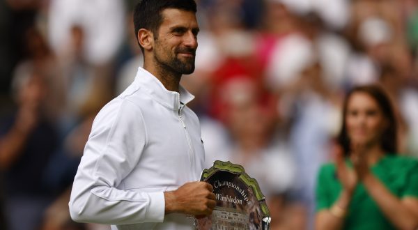 epa10750313 Runner-up Novak Djokovic of Serbia poses with the trophy after losing his Men's Singles final match against Carlos Alcaraz of Spain at the Wimbledon Championships, Wimbledon, Britain, 16 July 2023.  EPA/TOLGA AKMEN   EDITORIAL USE ONLY  EDITORIAL USE ONLY
