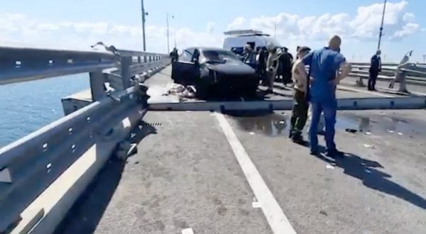 epa10751241 A still image taken from a handout video made available by Russia's Investigative Committee shows Russian Investigative Committee officers examining the damage on the Kerch Bridge connecting Crimea to mainland Russia, 17 July 2023. The Investigative Committee of Russia said that one of the sections of the Crimean bridge was damaged in the night of 16 to 17 July. Two civilians, a man and a woman, were killed while driving a car across the bridge; their minor daughter was injured in the incident, the statement added. Russia has blamed 'special services of Ukraine' for the 'attack', and said it launched a criminal investigation into the incident.  EPA/INVESTIGATIVE COMMITTEE OF THE RUSSIAN FEDERATION -- BEST QUALITY AVAILABLE -- MANDATORY CREDIT -- HANDOUT EDITORIAL USE ONLY/NO SALES
