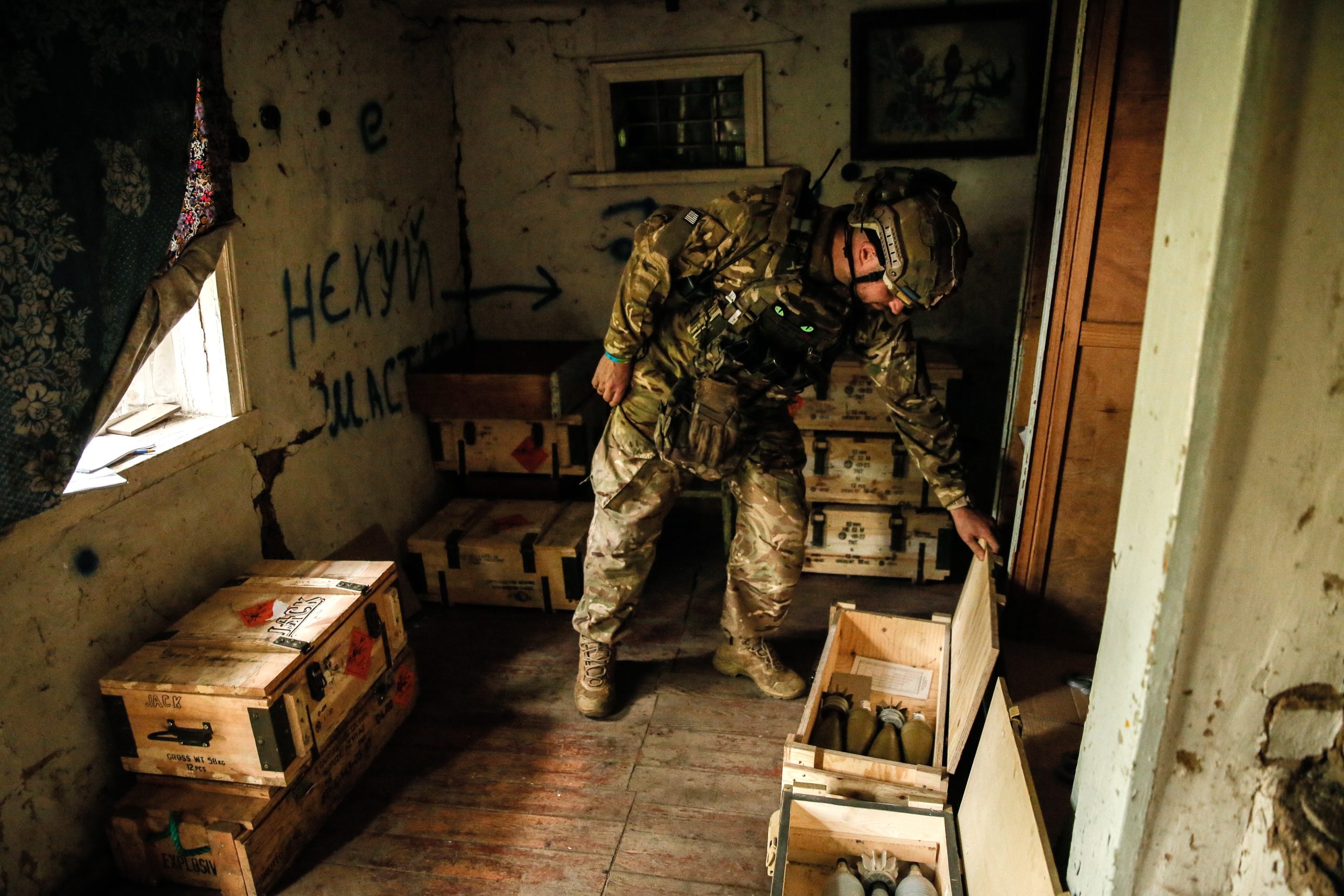 epa10758506 A Ukrainian serviceman of the 24 separate mechanized brigade named after King Danylo, opens the box with mortar shells at a military positions in the Donetsk region, Ukraine, 20 July 2023. The war in Ukraine, which started when Russia entered the country in February 2022, marked in July its 500th day. According to the UN, since the conflict started, more than 9000 civilians have been killed and more than 6 million others are now refugees worldwide.  EPA/OLEG PETRASYUK