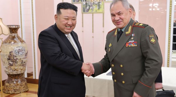 epa10770768 A photo released by the official North Korean Central News Agency (KCNA) shows North Korean Supreme Leader Kim Jong-un (L) shaking hands with Minister of Defense of the Russian Federation Sergei Shoigu (R) during a meeting at the office building of the Party Central Committee in Pyongyang, North Korea, 26 July 2023 (issued 27 July 2023). Shoigu is on a visit to North Korea coinciding with the nation's celebration of the armistice that ceased direct conflict in the 1950-53 Korean War.  EPA/KCNA   EDITORIAL USE ONLY