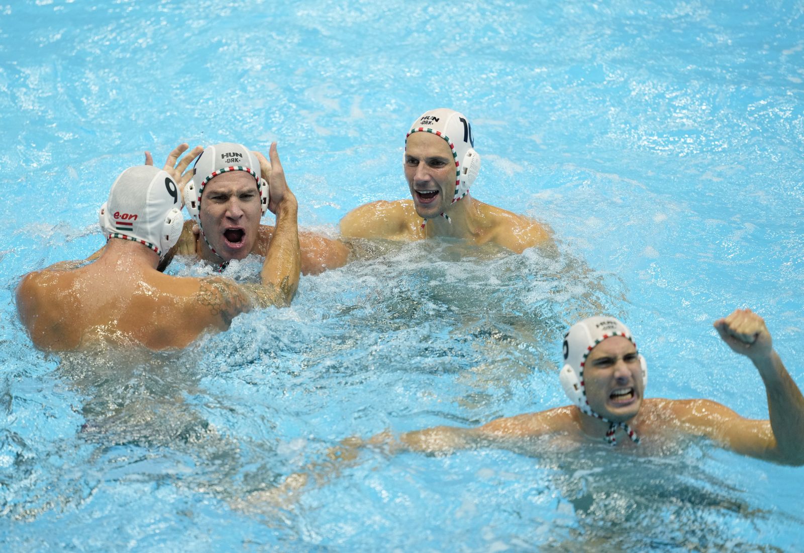 epa10771088 Hungary team players celebrate after defeating Spain at the Men's Water Polo Semifinal match between Hungary and Spain during the World Aquatics Championships 2023 in Fukuoka, Japan, 27 July 2023.  EPA/FRANCK ROBICHON