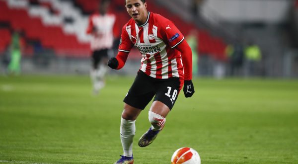 PSV's Mohamed Ihattaren runs witty the ball during the group E Europa League soccer match between PSV and Omonia at the Philips stadium in Eindhoven, Netherlands, Thursday, Dec. 10, 2020. (AP Photo/Peter Dejong)