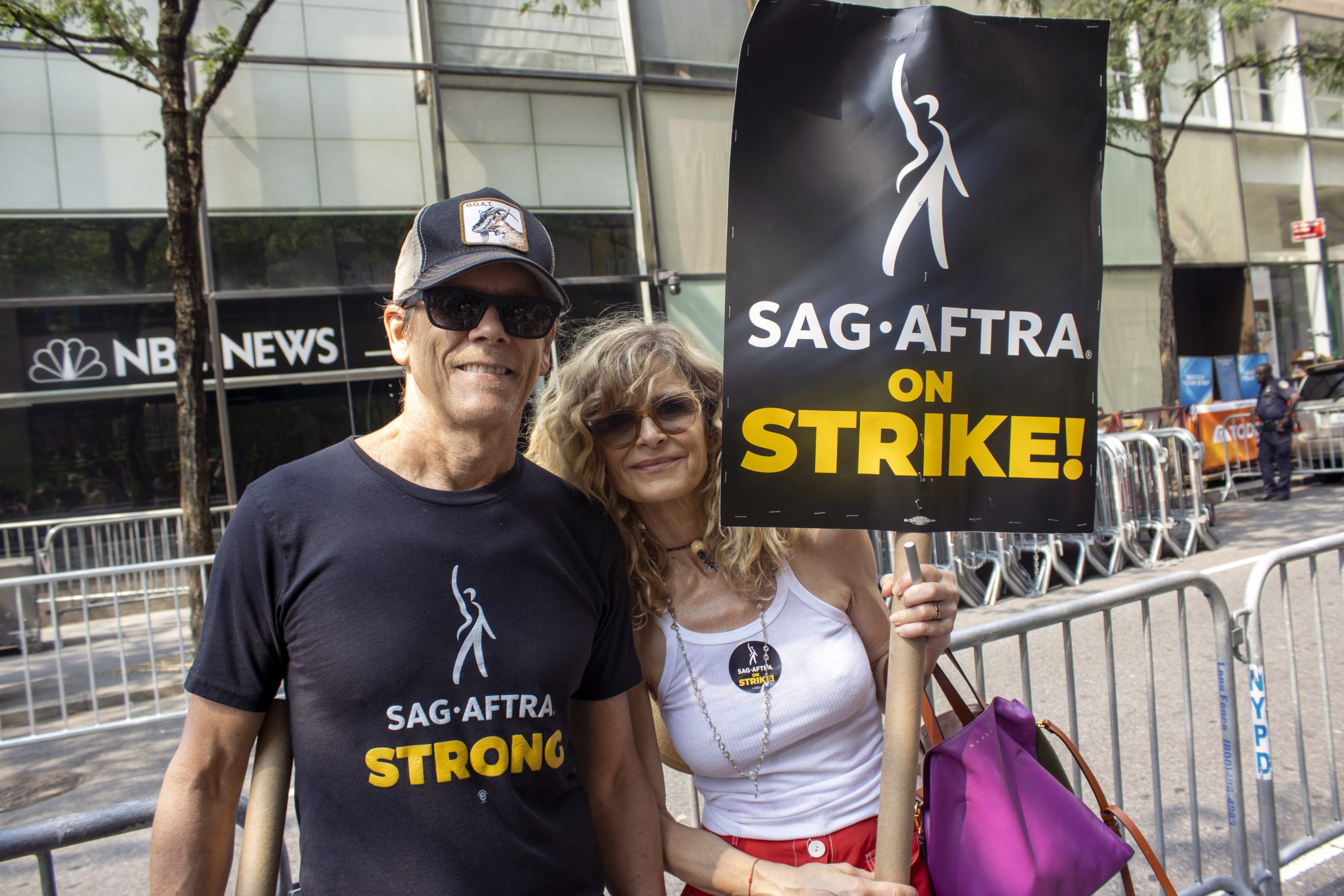 Husband and wife actors Kevin Bacon and Kyra Sedgwick are part of the picket line outside NBCUniversal at 30 Rockefeller Plaza in New York on Tuesday, July 18, 2023. Solidarity and stamina are themes on picket lines in New York as striking actors and writers are bracing for a long standoff with studios. (AP Photo/Ted Shaffrey)