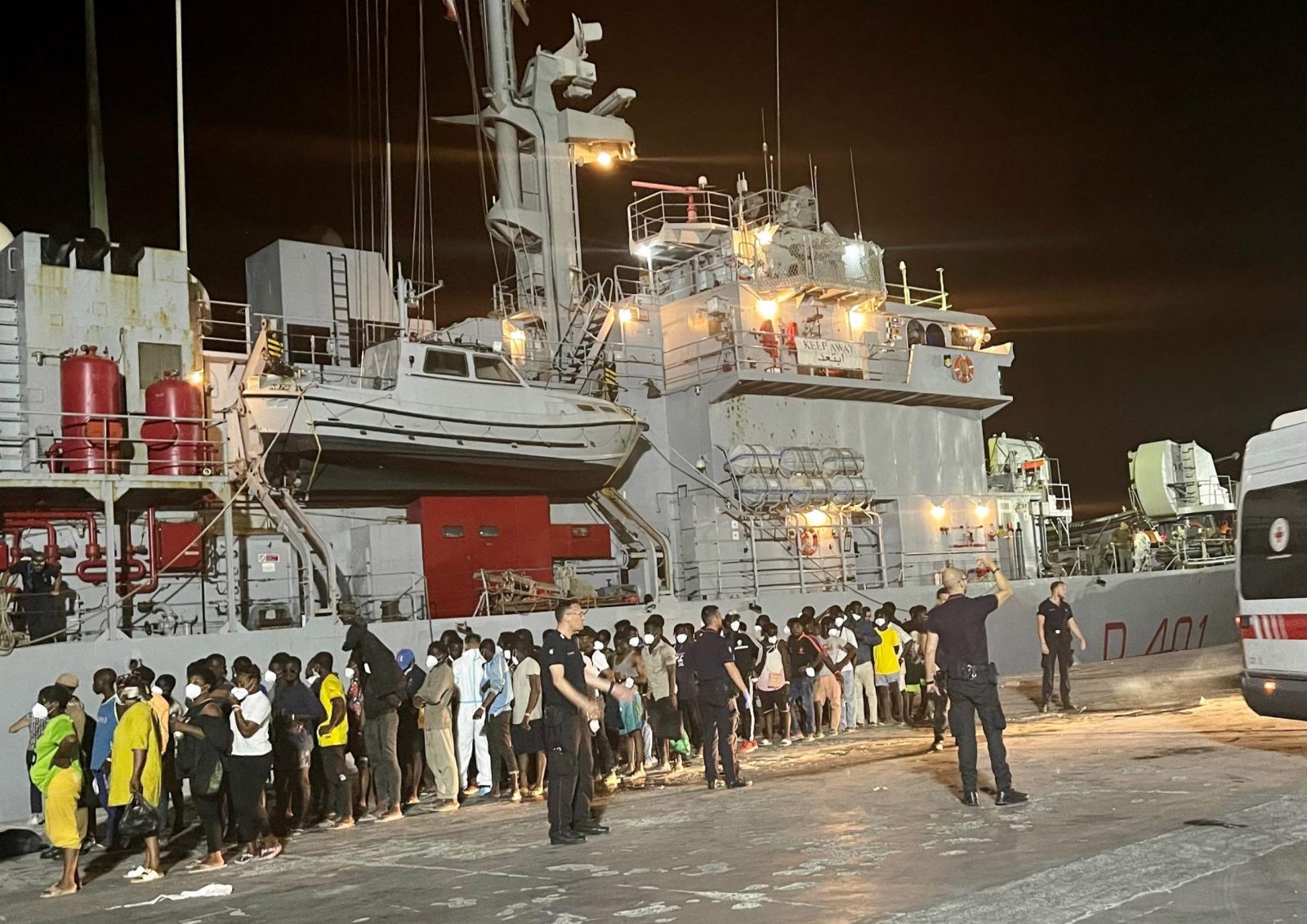epa10753424 Around 700 migrants wait to board an Italian Navy ship to be taken to Messina and Calabria, from Lampedua, Italy, early 18 July 2023. Over 2,000 people are present in the hotspot of the island Lampedusa.  EPA/ELIO DESIDERIO