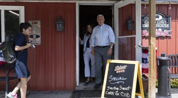 epa10758560 Republican candidate for President, former Vice President Mike Pence (R) and his wife Karen (L) exit Goody Coles BBQ after having lunch with supporters during a campaign stop in Brentwood, New Hampshire, USA, 20 July 2023. Pence is on a three-day campaign trip to the Republican first primary state of New Hampshire.  EPA/CJ GUNTHER