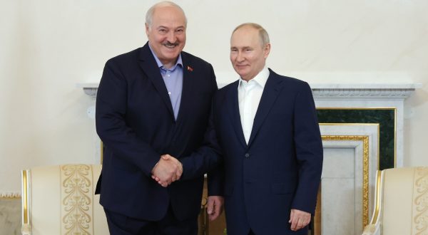 epa10763679 Russian President Vladimir Putin (R) shakes hands with his Belarusian counterpart Alexander Lukashenko in St. Petersburg, Russia, 23 July 2023. Alexander Lukashenko is on working visit to Russia.  EPA/ALEXANDER DEMYANCHUK / KREMLIN / POOL