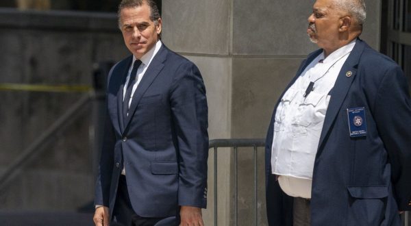 epa10770130 Hunter Biden (L) departs the US Federal District Court in Wilmington, Delaware, USA, 26 July 2023. Hunter Biden's hearing ended with him pleading not guilty after US District Judge Maryellen Noreika said she was not ready to accept the plea deal.  EPA/SHAWN THEW