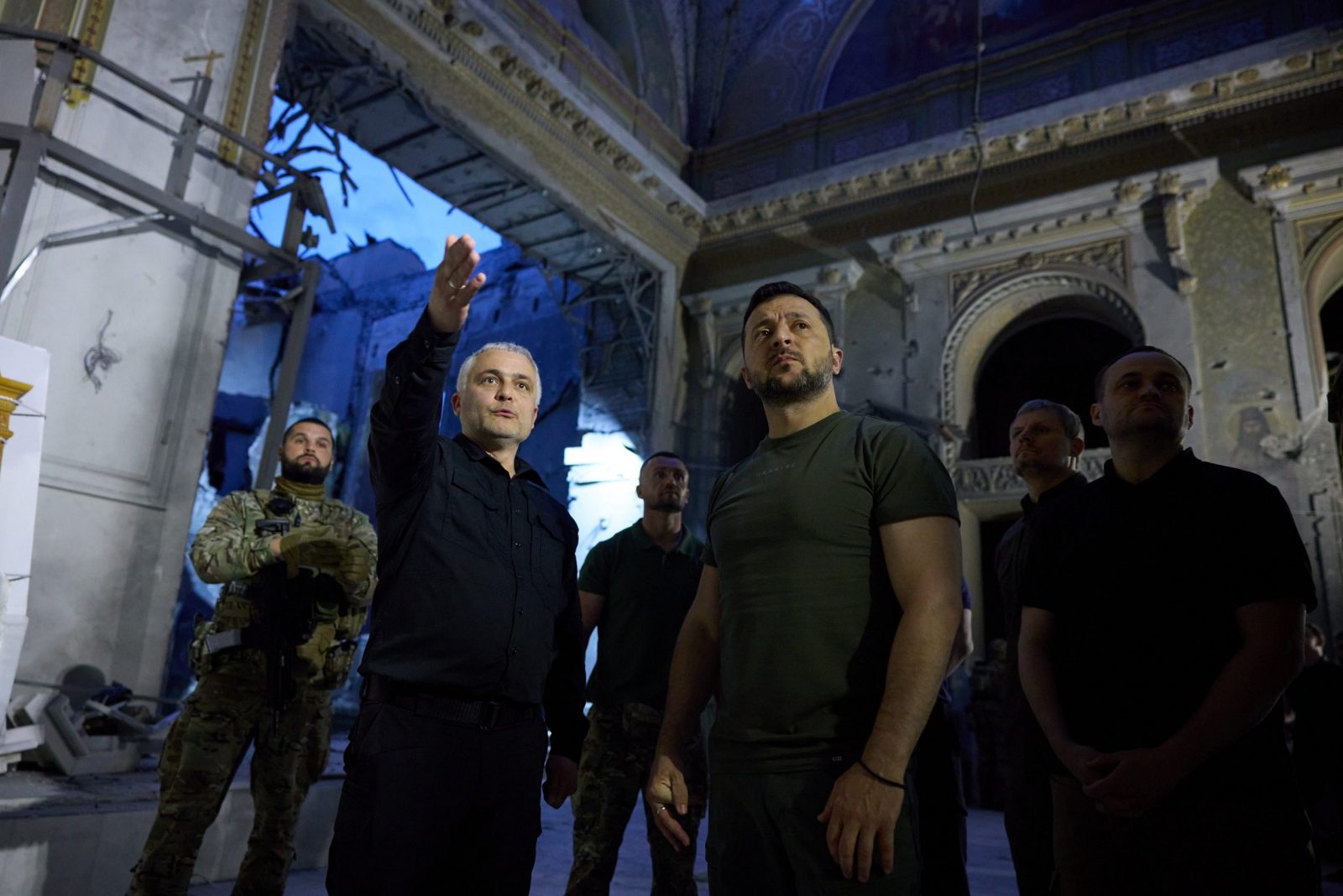 epa10772822 A handout photo made available by the Ukrainian Presidential Press Service shows Ukraine's President Volodymyr Zelensky (2-R) inspecting the damage inside the Spaso-Preobrazhensky Cathedral (Transfiguration Cathedral) during a working trip in Odesa, southern Ukraine, 27 July 2023 (issued 28 July 2023). According to the Ukrainian presidential office, Zelensky was briefed about the extent of the damage of the church and its current condition. On 23 July 2023, the Orthodox cathedral was severely damaged by a Russian missile attack. The UNESCO has condemned Russian attacks on World Heritage sites in Ukraine, including the Spaso-Preobrazhensky Cathedral. Russia, which began its full-scale invasion of Ukraine in February 2022, has recently pulled out of a UN-Turkey brokered agreement guaranteeing safe passage to Ukrainian grain exports through the Black Sea and started the mass shelling of Odesa city, granaries, agricultural enterprises, and sea ports.  EPA/UKRAINIAN PRESIDENTIAL PRESS SERVICE HANDOUT -- MANDATORY CREDIT: UKRAINIAN PRESIDENTIAL PRESS SERVICE -- HANDOUT EDITORIAL USE ONLY/NO SALES