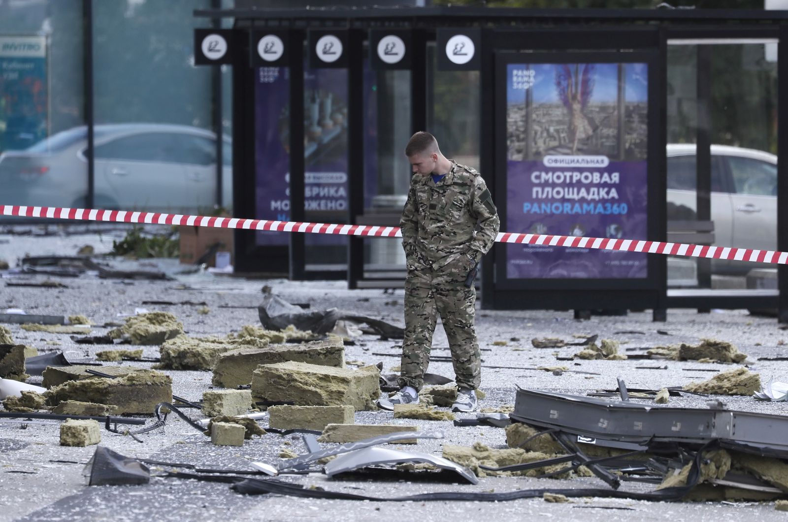epa10776546 An official inspects debris at the site of a damaged building in the Moscow-City business center following a reported drone attack in Moscow, Russia, 30 July 2023. The Russian Ministry of Defense on 30 July accused Ukraine of carrying out an attack with three unmanned aerial vehicles (UAV) against facilities in Moscow, adding that the attack was foiled and the three UAVs 'were suppressed by means of electronic warfare and crashed' leaving no casualties.  EPA/YURI KOCHETKOV